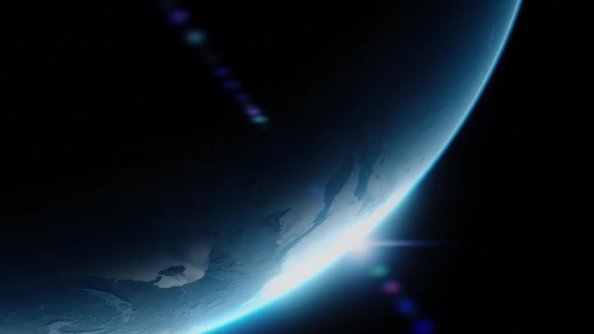 Planet seen from space with a sunlit band emerging along the horizon