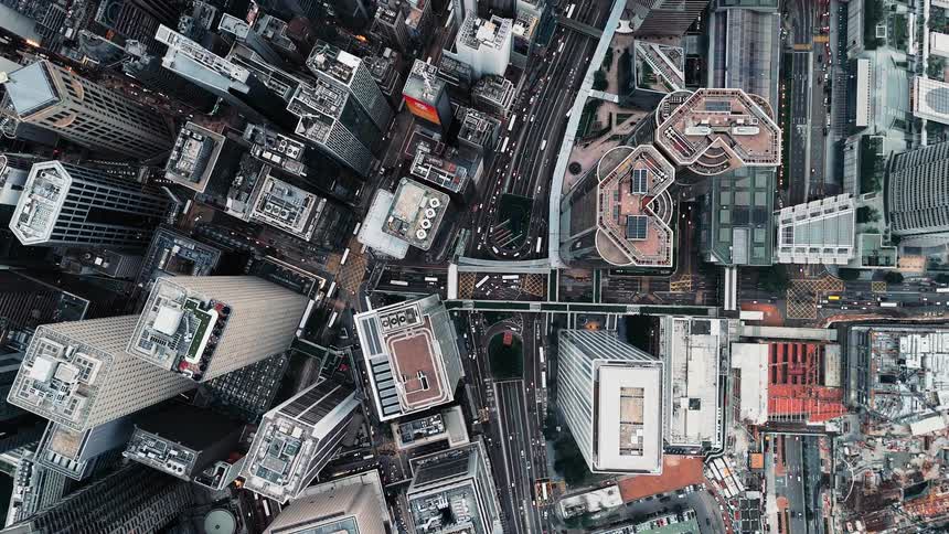 An aerial view of tall towers in a city
