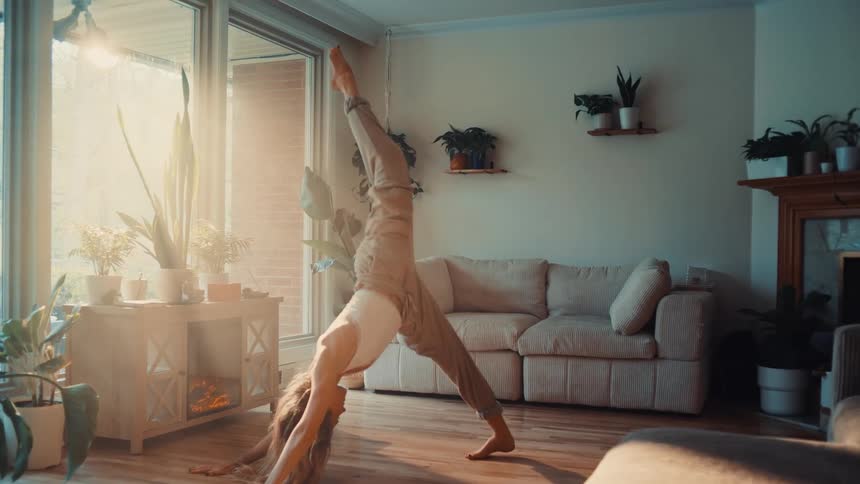 The woman is stretching at home