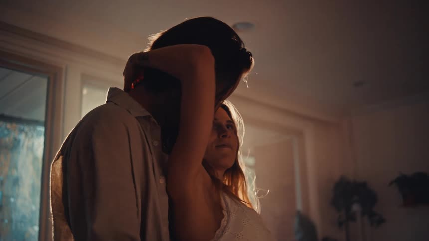 A man and woman hugging each other