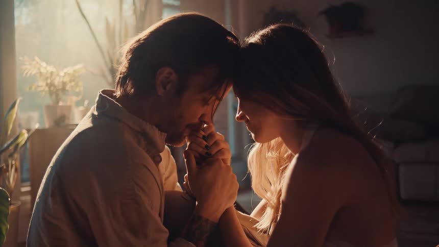A man and woman holding each other