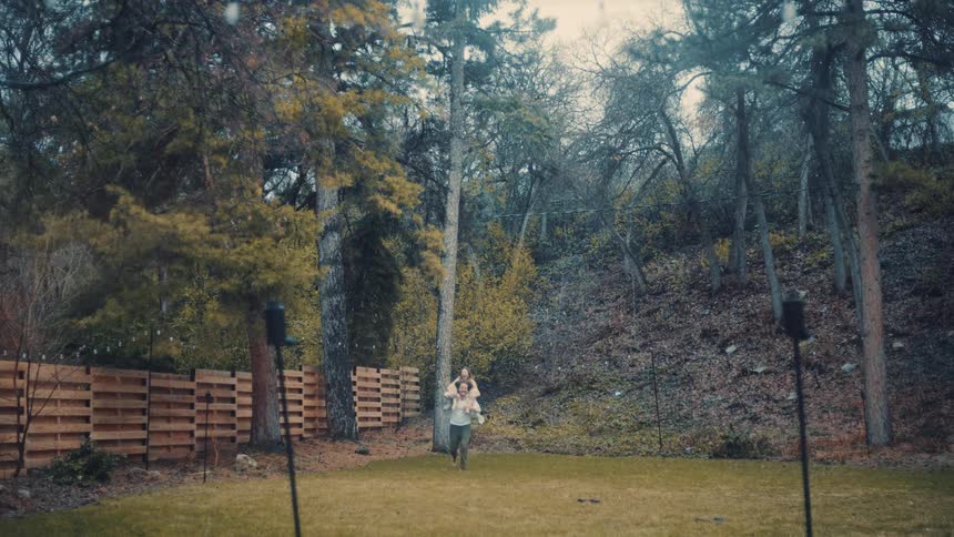 The man is running while giving a woman a piggy back ride