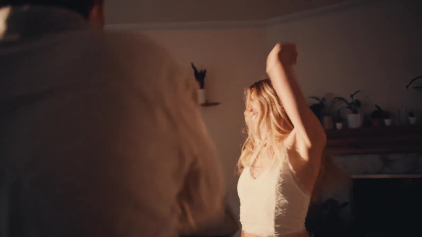 A man and woman dancing in a room