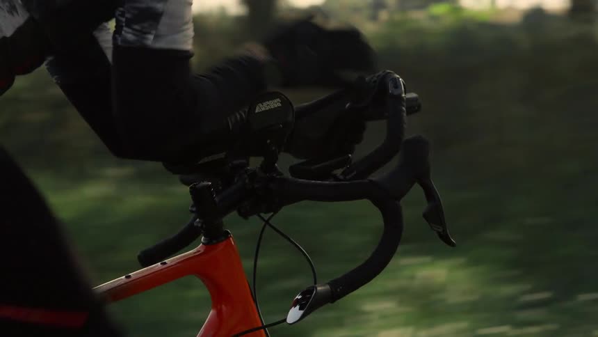 A man riding a bicycle down a road