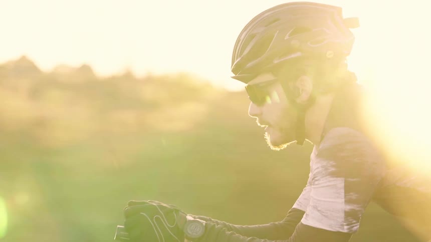 The man races on his bicycle