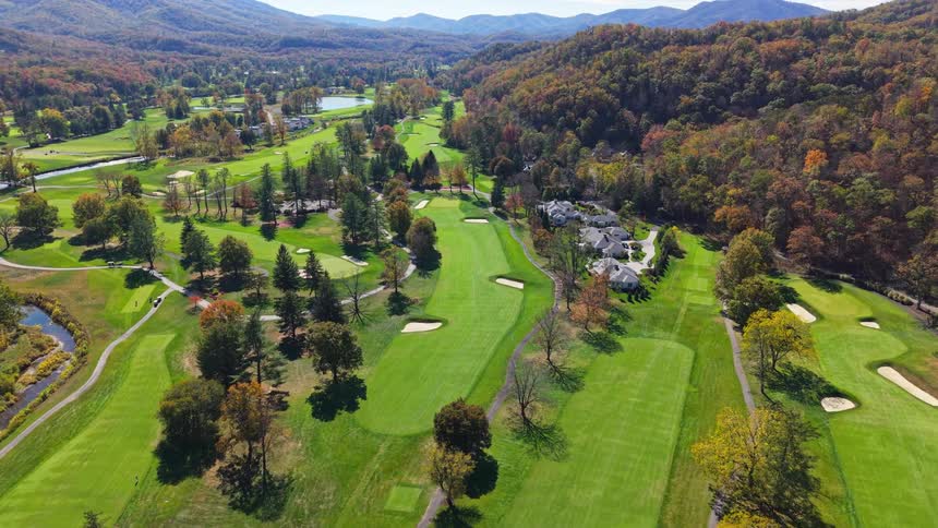 Aerial of a green golf course outdoors during daytime