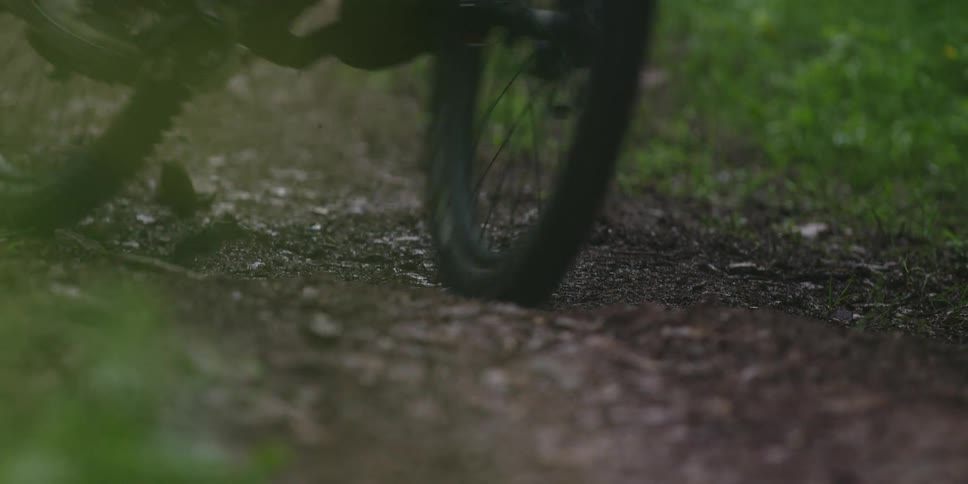 Bicycle tires moving on a dirt trail