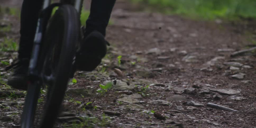 Bicycle sliding across the dirt and stones on the ground