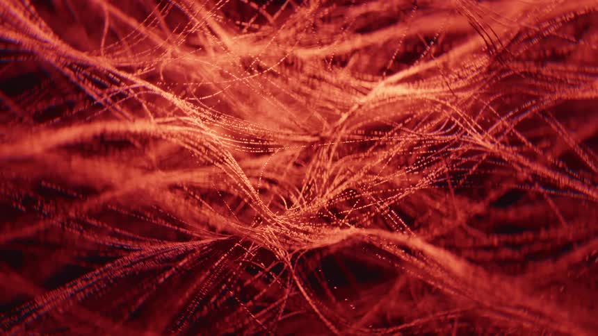 This is a closeup abstract animation featuring a tangled network of fine glowing orange and red lines that resemble fibers or tendrils small bright points of light travel rapidly along these intersecting lines creating a sense of movement and energy