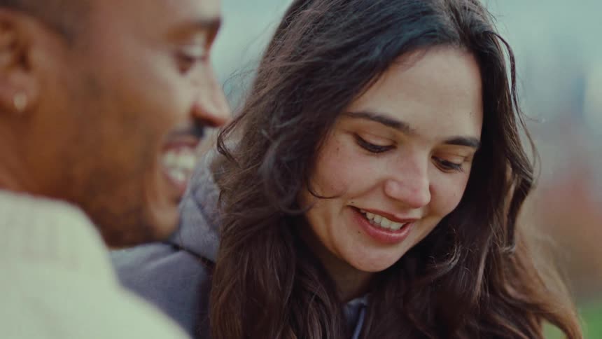 Close up of a couple conversing during a date outdoors during daytime