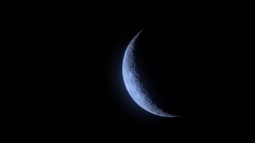 A close view of the bright crescent moon with visible surface texture set against a completely black background