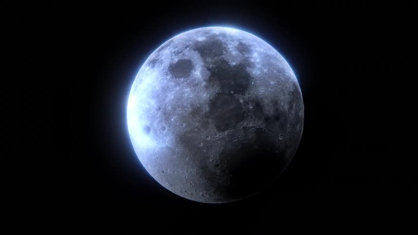 The moon glows in the darkness of outer space