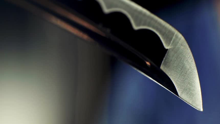 Katana blade in closeup with focus on the tip and edge