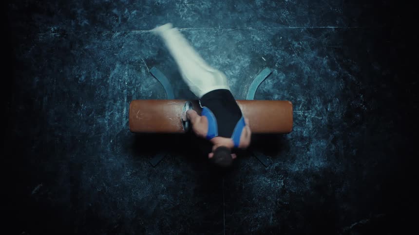 A man doing acrobatics in a gym