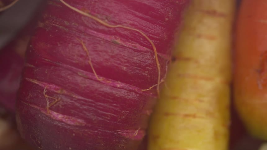 Fruits are packed together in a basket placed outdoors