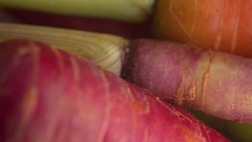 A close up of some carrots on a table