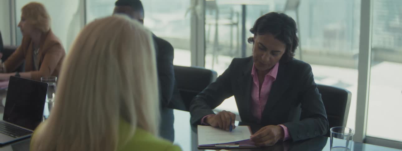 A group of coworkers working in a boardroom