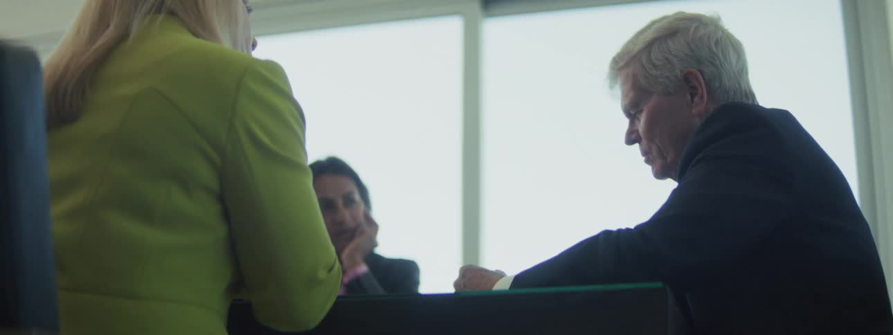 A group of people that are working in an office
