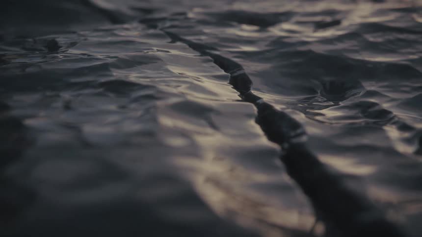 A shiny surface with a crack through it
