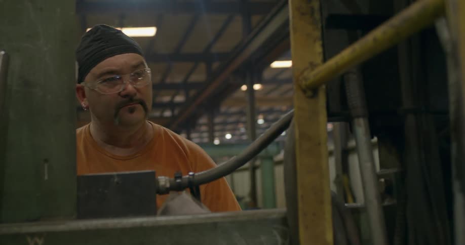 A man works in a factory