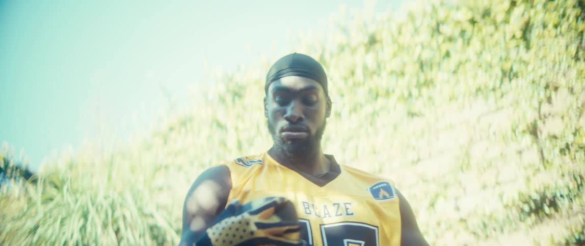 The man winds back and throws the football