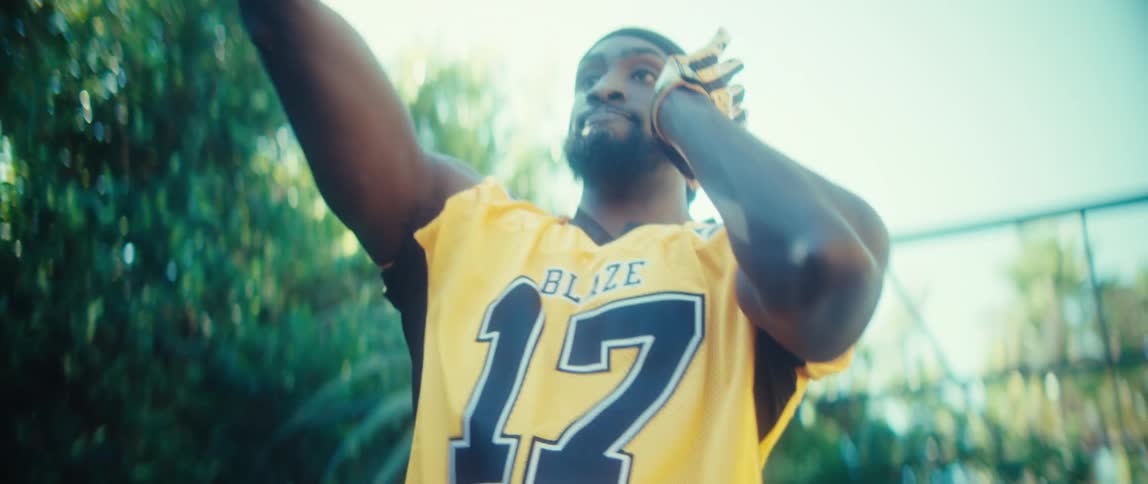 Man playing american football outdoors