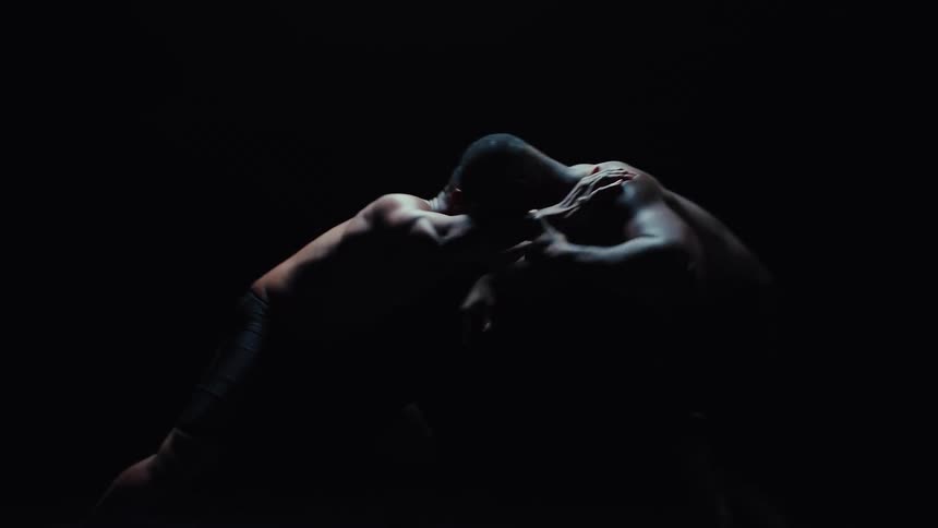 The man takes down his opponent while wrestling