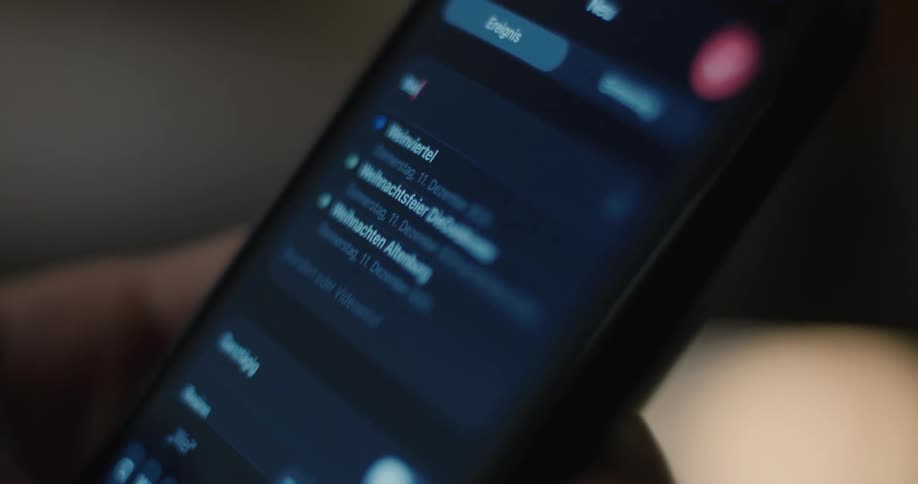 Persons fingers scrolling through a calendar and datebook on their smart phone