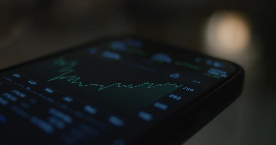 Graph and numbers moving on the screen of a smart phone