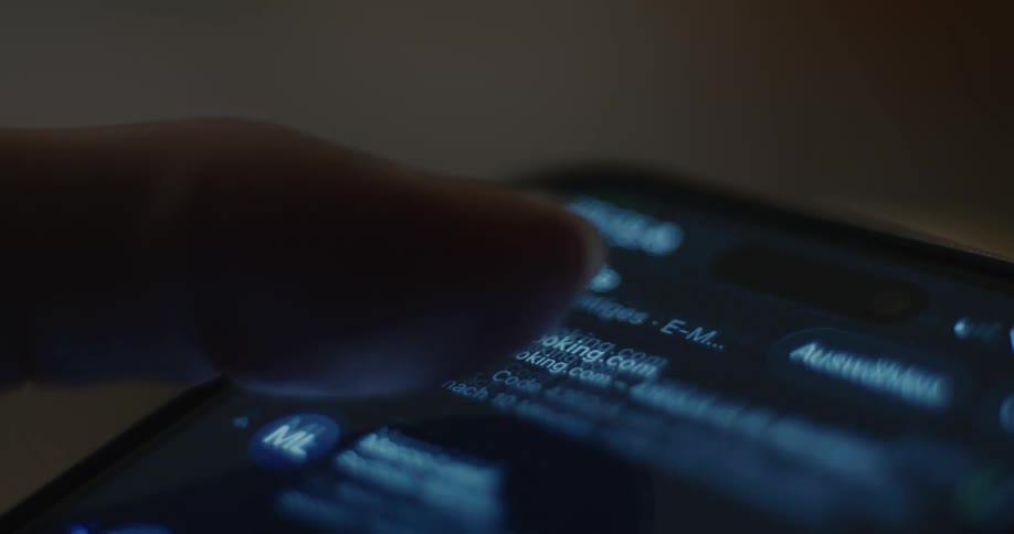 Persons fingers pressing an icon and scrolling on their smart phone