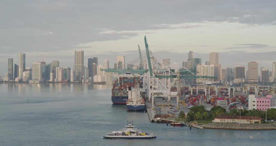 Port of miami with docked ships and cargoes in the evening