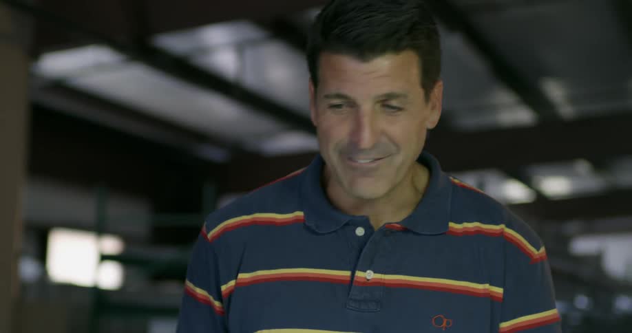 A man talks in a warehouse