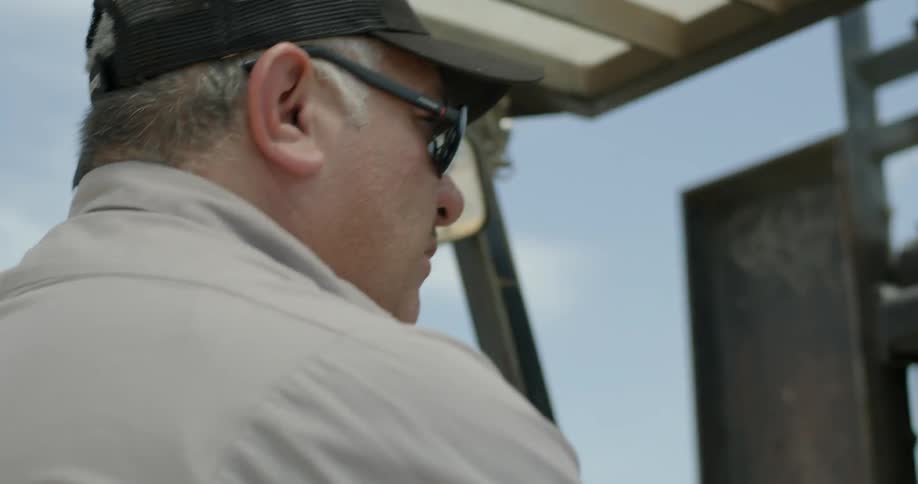 A man drives a forklift