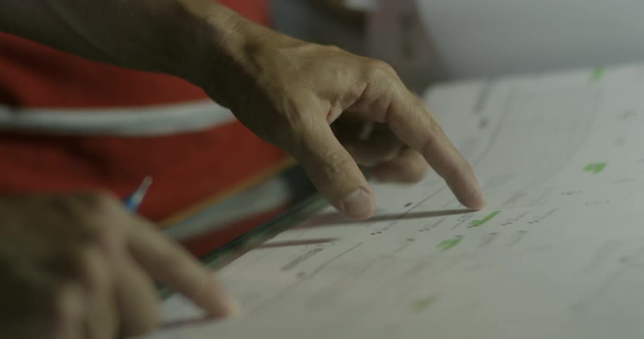A man points at a piece of paper