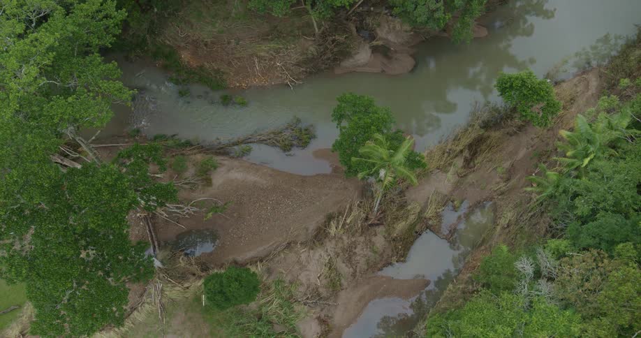 An aerial view of a river that has run over its banks