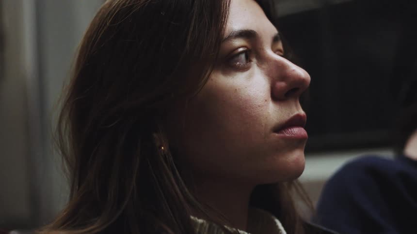 A woman riding on public transportation