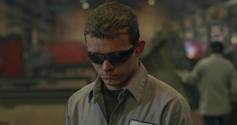 A man stands in a steel factory