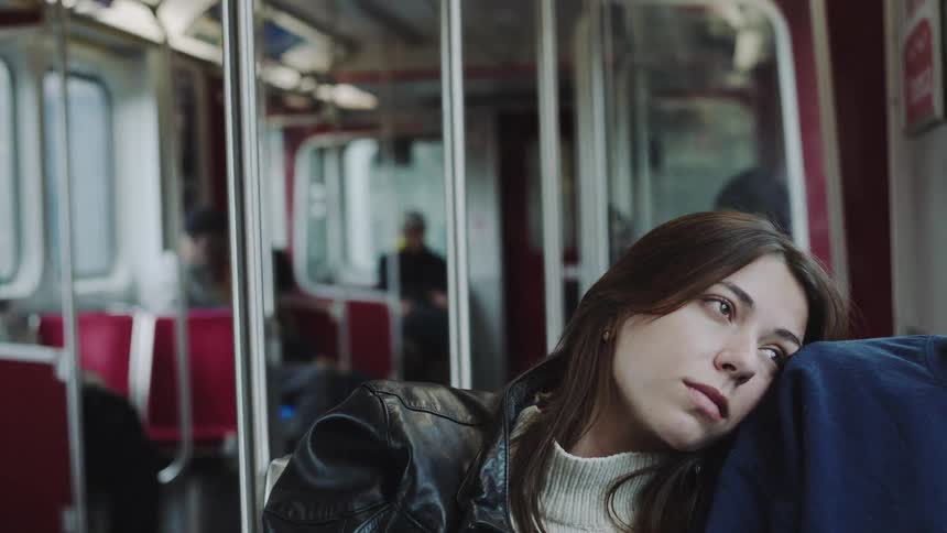 A woman riding on a train
