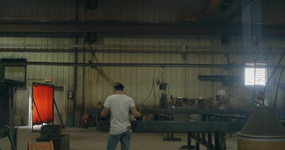 Men work in a steel factory