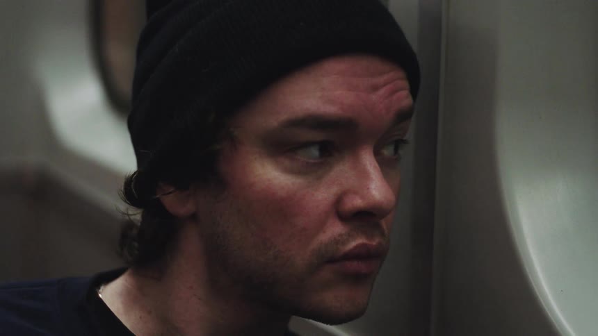 A man sitting on a train