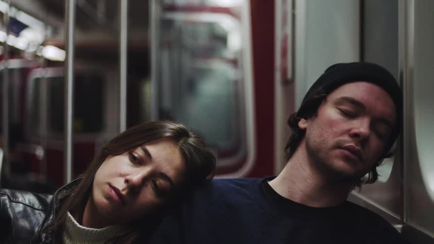A man and woman on a train
