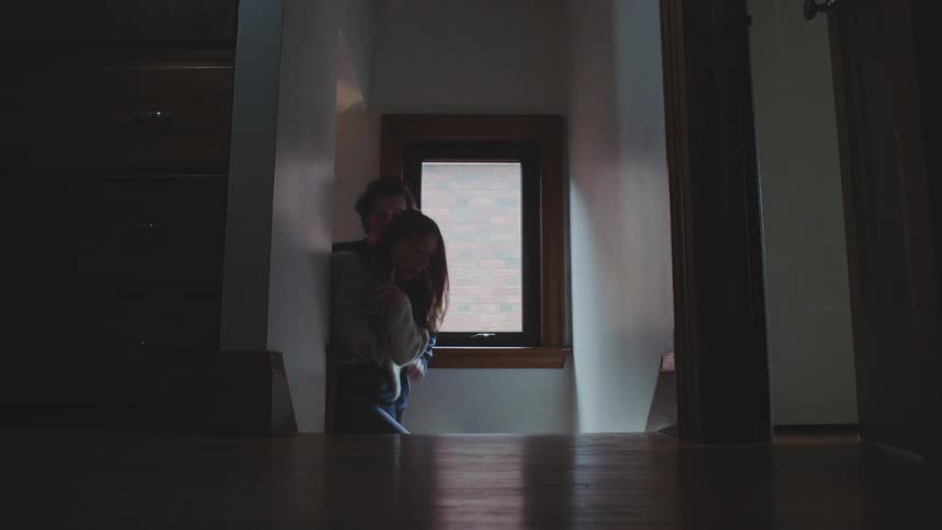A man and woman flirting walking up stairs