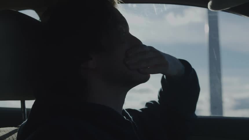 The man stops the car and gets out