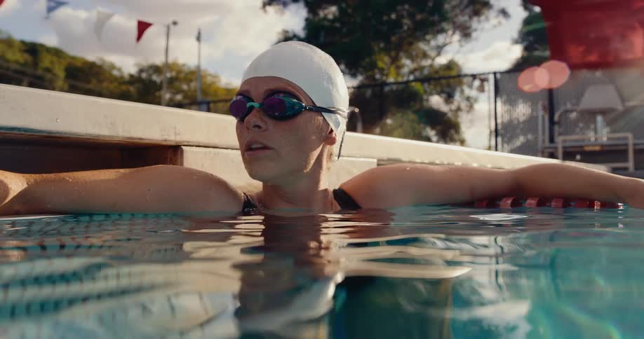 A woman in a pool wearing swimming gear