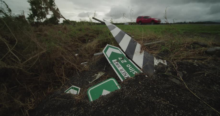 A destroyed sign sitting outdoors