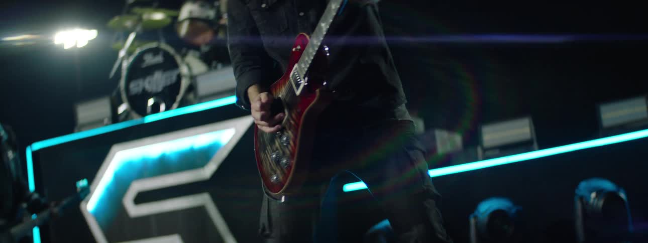 A band playing on a stage outdoors