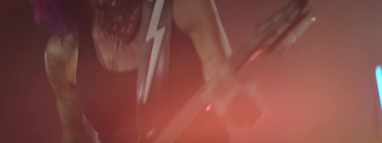Woman playing guitar in a performance