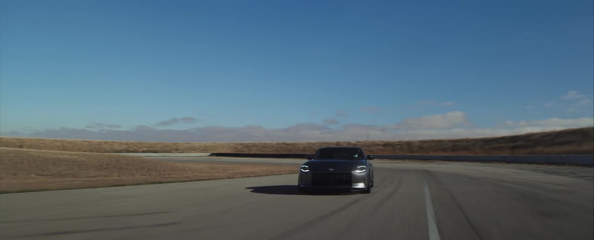 The car is racing around the track
