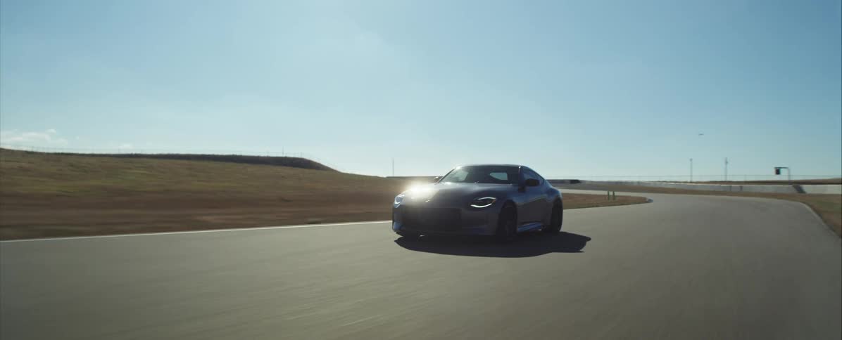 Black sports car travels fast on the highway