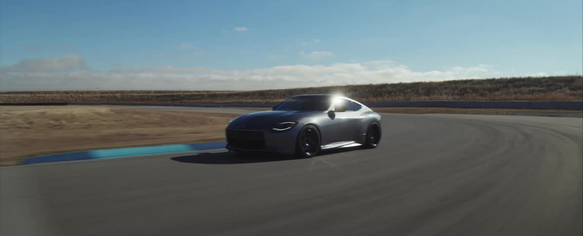 The sports car is driving on the race track